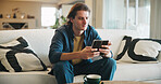 Reading, man and thinking with phone in home for texting with contact, app and social media. Scroll, person and chat with digital tech in living room for online, typing message or website in lounge