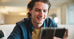 Happy, man and communication with phone in home for texting with contact, app and social media. Smile, person and chat with digital tech in living room for online, typing message or website in lounge