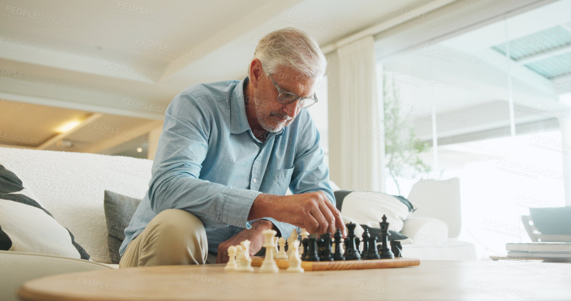 Buy stock photo Man, chess and game in home with strategy, solution or problem solving in contest in living room. Mature person, boardgame and idea with competition for thinking, knowledge or challenge in lounge
