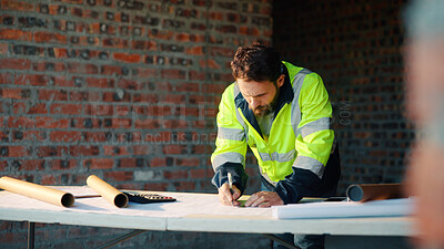 Buy stock photo Construction site, writing and man with blueprint for planning, layout and building measurements. Civil engineer, architecture and person with paper for renovation design, evaluation and dimensions