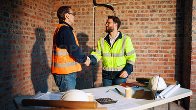 Buy stock photo Happy, handshake and men in meeting on construction site for agreement, compliance and inspection. Team, architecture and people shaking hands for building project, infrastructure and development