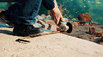 Hands, engineer and grinder with metal at construction site for welding, cutting rod and manual labor. Person, electric tool and sparks for steel fabrication, surface smoothing and building industry