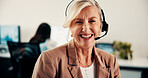 Portrait, headset and woman in call center for communication or customer service. Happy, professional or mature consultant with smile for e commerce assistance, CRM or friendly support in office