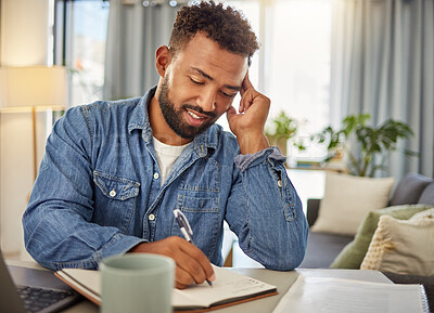 Buy stock photo Man, remote work and writing with notebook in home for research, schedule and story headline. Smile, male freelancer and laptop with notes, copywriting information and planning for article submission