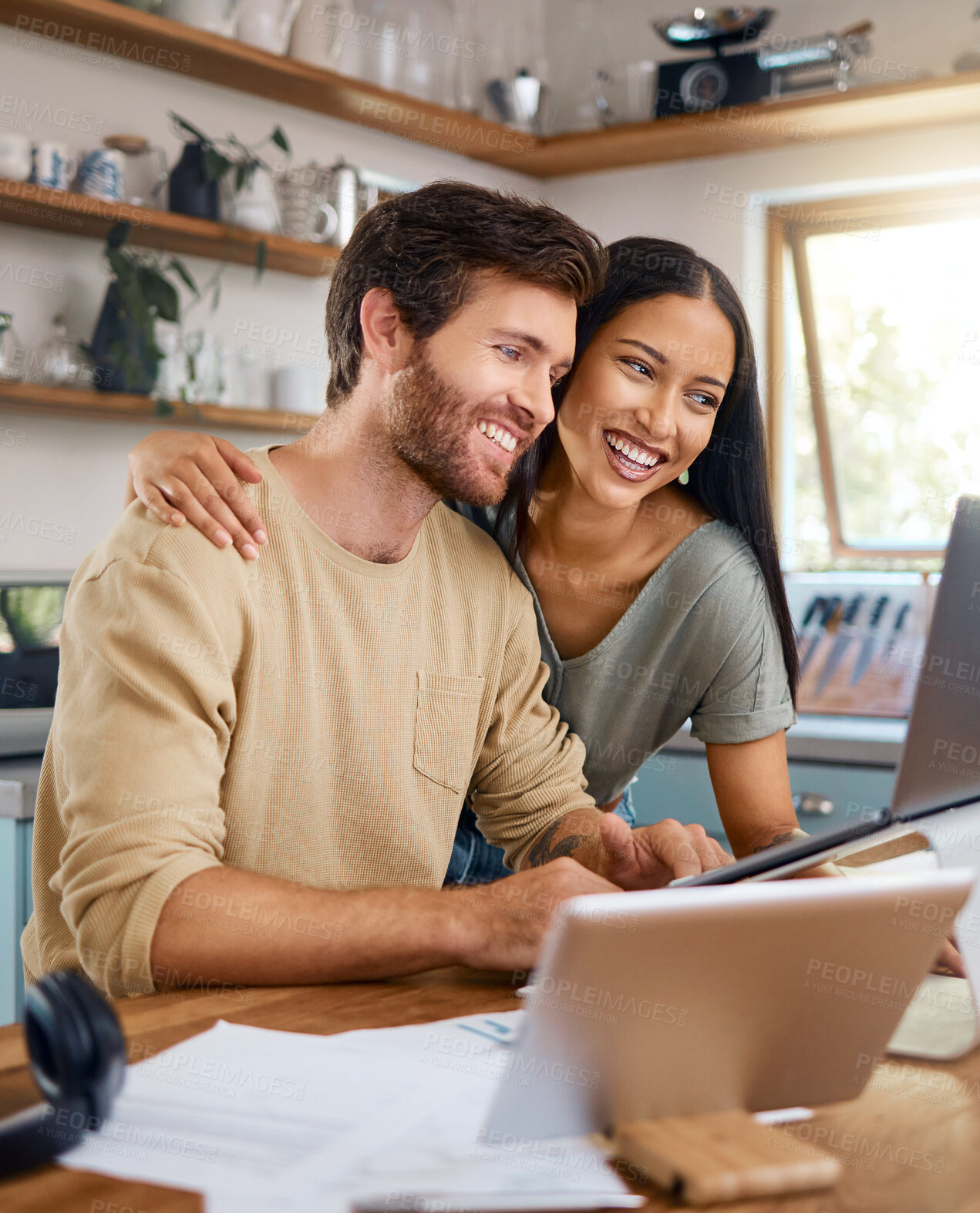 Buy stock photo Smile, couple and research with laptop in kitchen for audit, finance report and banking. Happy, people and embrace with tech for mortgage, household budget and investment for savings account at house