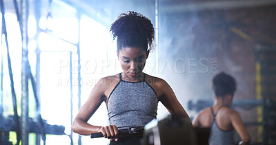 Buy stock photo Fitness, rowing and woman in gym for exercise, health or resistance training with active wellness. Balance, athlete and African person with equipment for strength, workout or practice in sport center