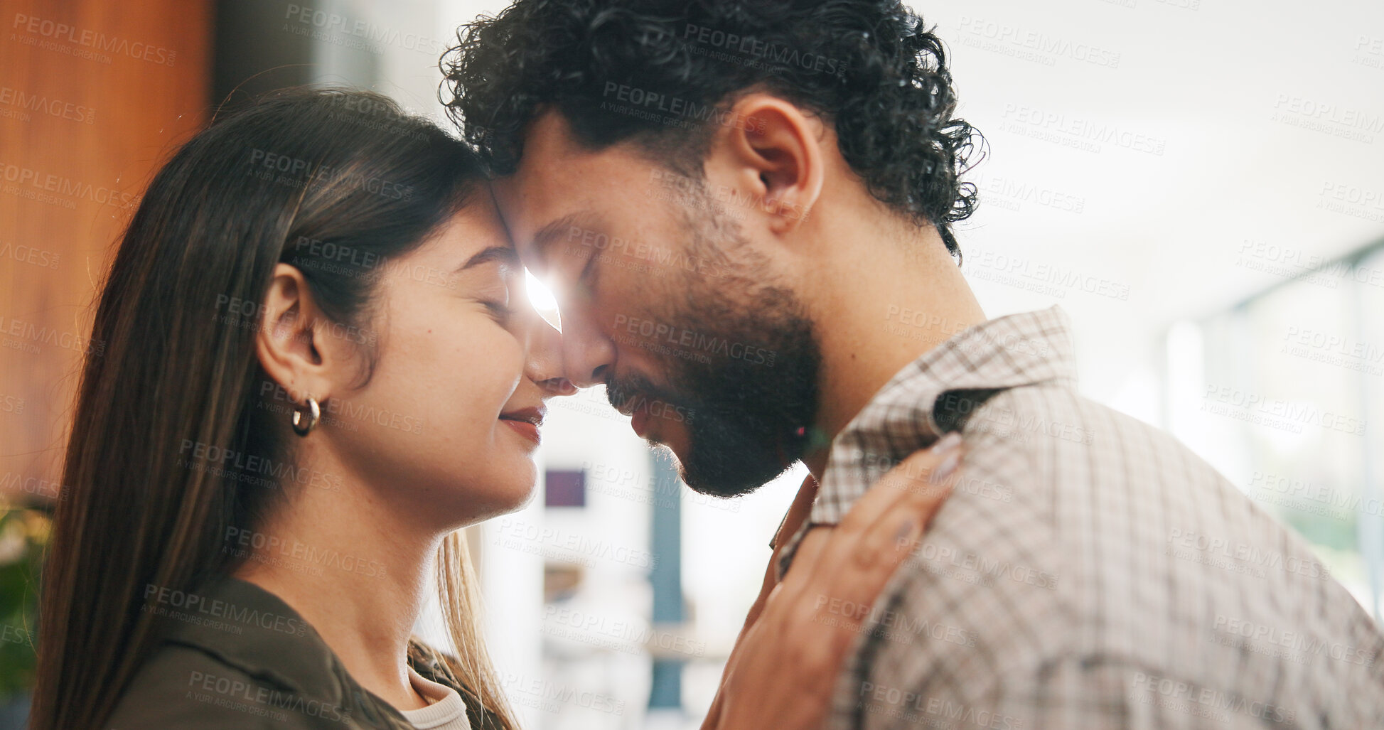 Buy stock photo Couple, forehead touch and love in home, care and bonding with smile or commitment for relationship. Calm, woman and affection for man on weekend, romance and support for partner and relax in house