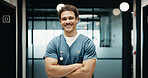 Portrait, man and nurse in hospital with arms crossed, smile and knowledge from medical internship. Happy, person and healthcare intern in clinic with confidence, about us and pride for patient care.