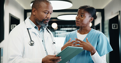 Buy stock photo Doctor, nurse and discussion in hospital with tablet, mentorship and research for medical internship. Black people, talk and manager in clinic with tech, training intern and advice for healthcare.