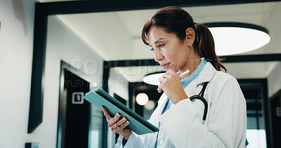 Buy stock photo Thinking, doctor and woman with tablet in hospital, medical journal and healthcare protocol revision. Reading, research or mature physician with ebook on clinical diagnosis, tech or policy reflection