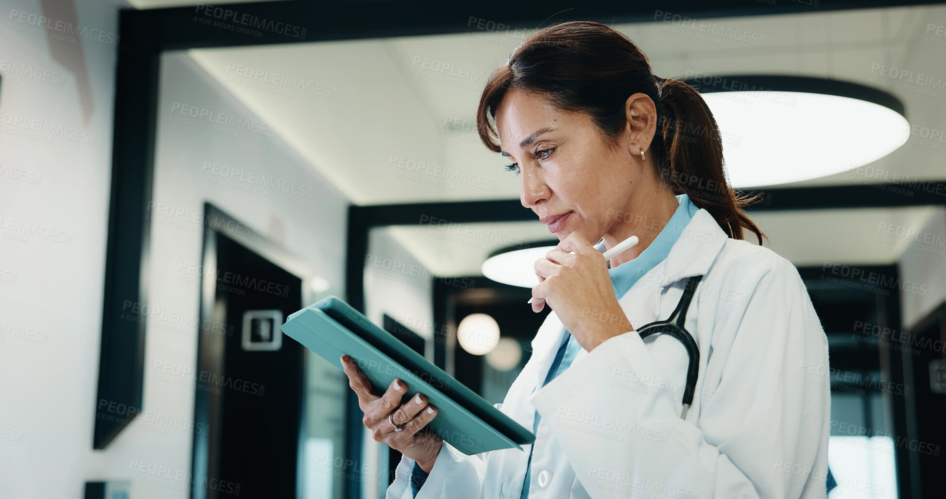 Buy stock photo Thinking, doctor and woman with tablet in hospital, medical journal and healthcare protocol revision. Reading, research or mature physician with ebook on clinical diagnosis, tech or policy reflection