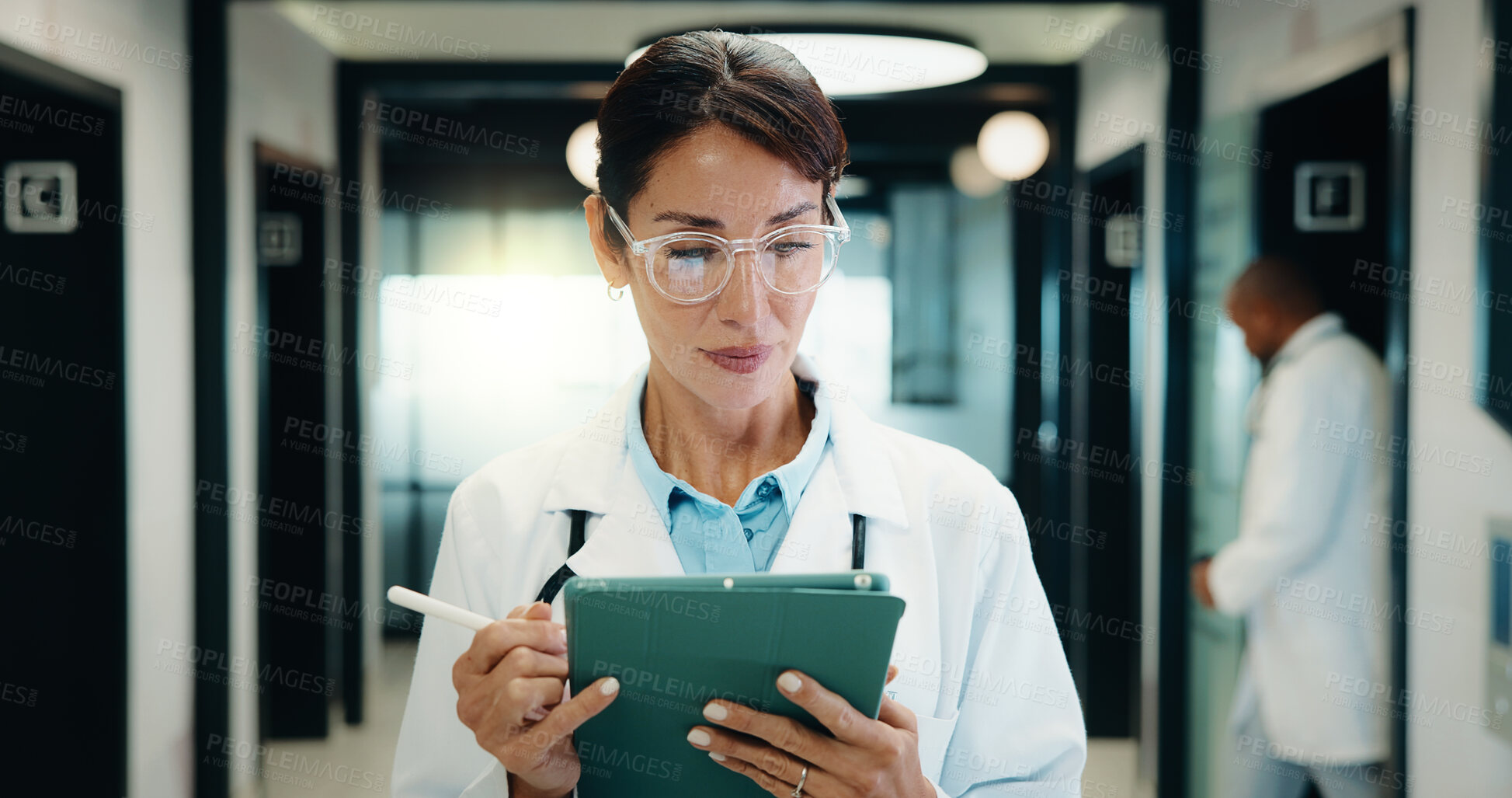 Buy stock photo Medical, doctor or tablet with pen in hospital for clinical notes, digital prescription or review. Professional, mature woman or health app with stylus for insurance records, test results and glasses