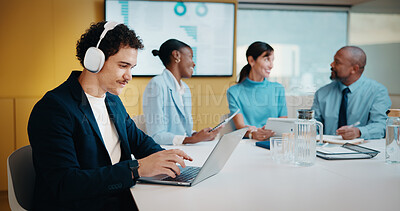 Buy stock photo Man, headphones and laptop in meeting at boardroom with typing, report or notes with team at finance company. Person, proposal and audio on computer for feedback, invest or asset management at agency
