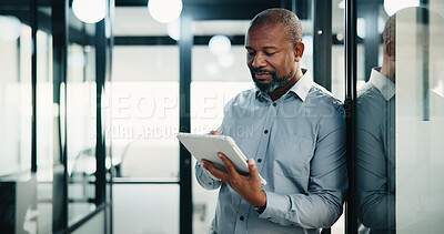 Buy stock photo Typing, black man and tablet in office for company report, finance or revenue service. Mature, businessman or accountant with digital tech for project management, investor contact and research