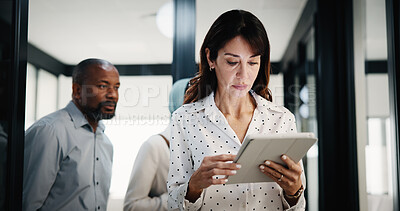 Buy stock photo Reading, woman and tablet in office for finance report, company or revenue service. Mature, business person or accountant with digital tech for project management, investor contact and research