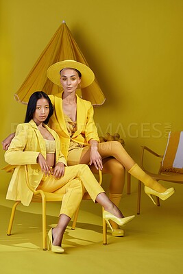 Buy stock photo Portrait, friends or women with fashion in studio, amber makeup or summer outfit for tropical aesthetic. Trendy color, bold eyeshadow or people with chic wardrobe, vacation style or yellow background