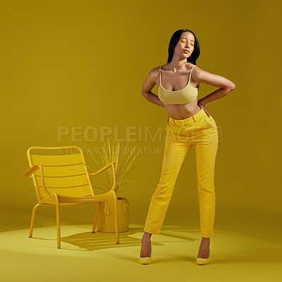 Buy stock photo Summer, fashion or woman with makeup in studio, amber eyeshadow or casual clothes for chic style. Minimal aesthetic, bold color or person with trendy wardrobe on yellow background, unique or stylish
