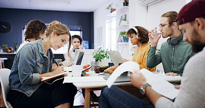 Buy stock photo Creative, business people and coworking with documents on laptop for project or design agency. Group, employees or team busy with paperwork or delegation for planning, tasks or agenda in workplace