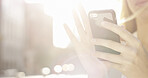 Hands, flare and woman with phone outdoor for text message, social media update or communication. Mobile, app and person in city for online chat, bokeh and internet connection with space in morning