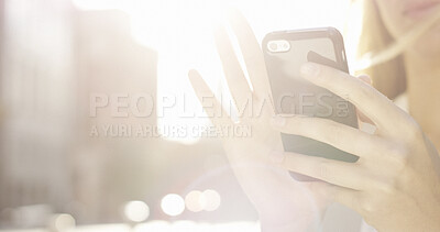 Buy stock photo Hands, flare and woman with phone outdoor for text message, social media update or communication. Mobile, app and person in city for online chat, bokeh and internet connection with space in morning