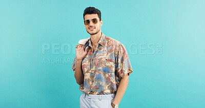 Buy stock photo Fashion, portrait and sunglasses with man in studio for holiday clothing or retro aesthetic. Shades, space and style with person on blue background for summer travel or vacation apparel and clothes