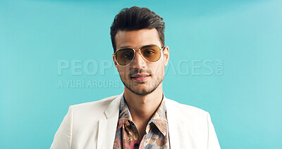 Buy stock photo Fashion, retro and man in studio with portrait, vintage clothing or funky patterns in 80s aesthetic. Space, sunglasses and person with confidence, nostalgic prints or classic style on blue background