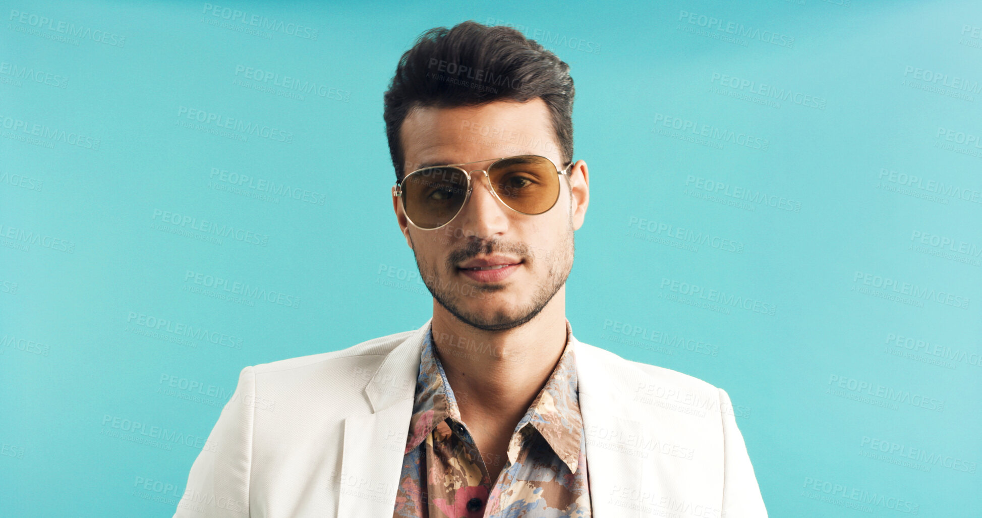 Buy stock photo Fashion, retro and man in studio with portrait, vintage clothing or funky patterns in 80s aesthetic. Space, sunglasses and person with confidence, nostalgic prints or classic style on blue background