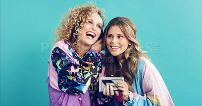 Buy stock photo Women, headphones and smile with tech for retro style, cosmetics and bonding with aesthetic. Studio background, friends and music with accessories for vintage fashion, space and celebration
