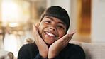 Portrait, child and face frame on couch with smile, positive attitude and childhood development. Happy, young kid and kindness in comfortable home with growth, unibrow and weekend in Philippines