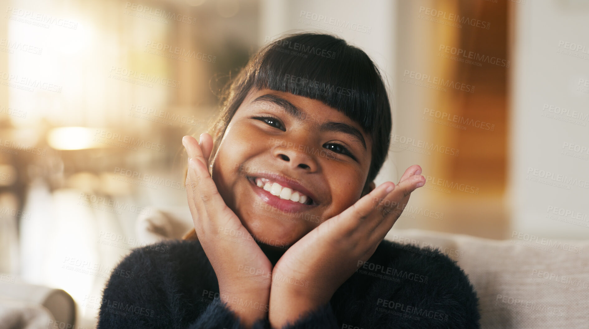Buy stock photo Portrait, child and face frame on couch with smile, positive attitude and childhood development. Happy, young kid and kindness in comfortable home with growth, unibrow and weekend in Philippines