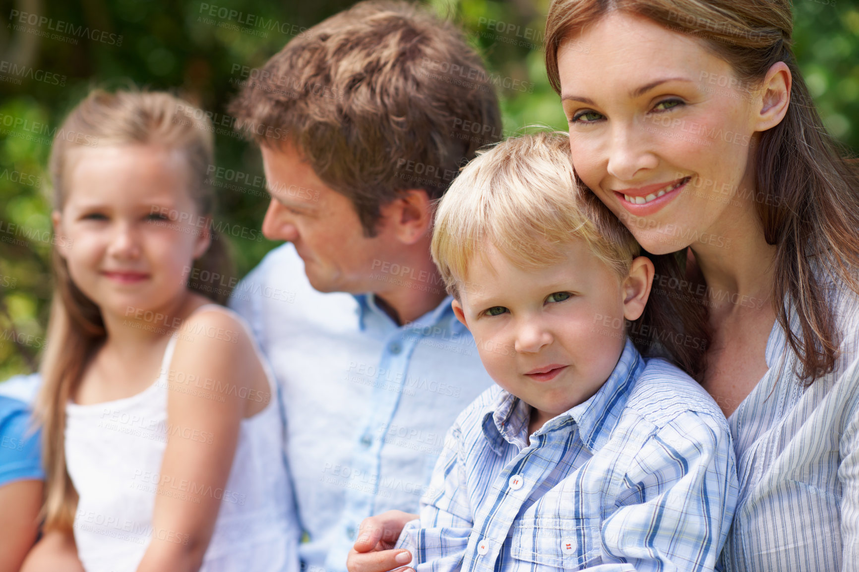 Buy stock photo Mom, child and family in nature with smile, bonding and relationship support on mothers day. Woman, kids and outdoor with husband for portrait, trust development and parent care in park with love