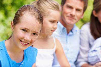 Buy stock photo Portrait, travel and child in nature with family, adventure and parental support on summer holiday. Smile, daughter or people at park with siblings, affection and bonding together on vacation getaway