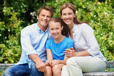 Buy stock photo Portrait, parents and smile with child at park for love, affection and bonding together on holiday. Happy, people and kid with positive attitude, family connection and vacation getaway in countryside