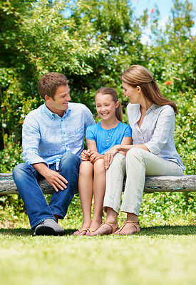 Buy stock photo Break, love and relax with family on swing in backyard together for bonding or conversation. Daughter, parents and summer in garden of home with happy people outdoor for relationship security