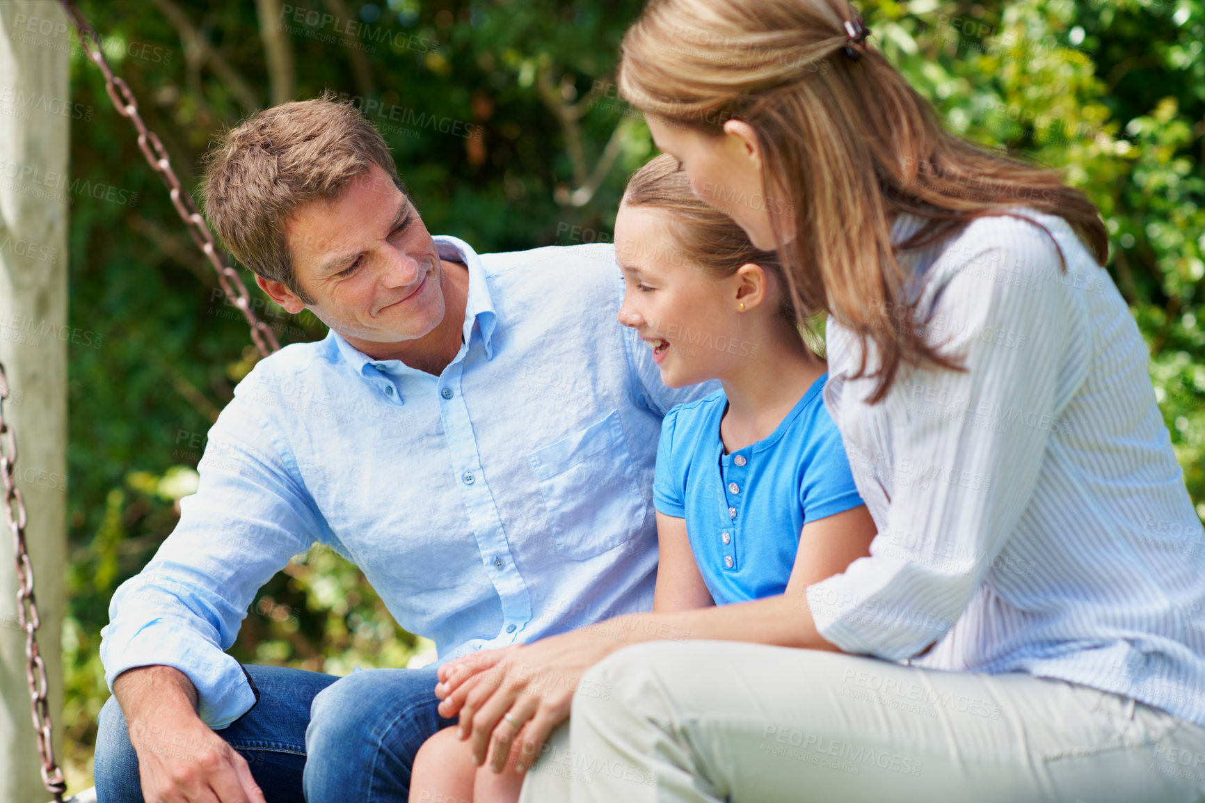 Buy stock photo Break, love and summer with family on swing in backyard together for bonding or conversation. Daughter, parents and relax in garden of home with happy people outdoor for relationship security