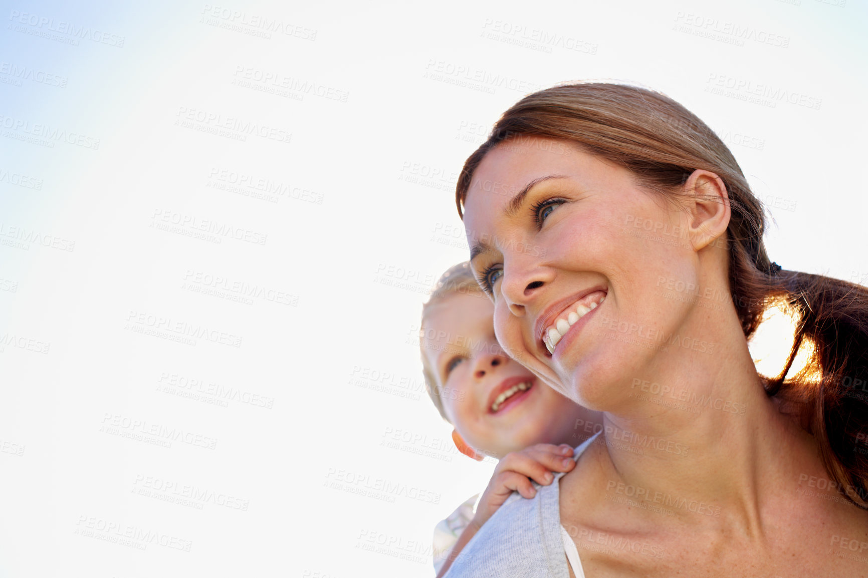 Buy stock photo Mother, child and piggyback with smile outdoor for bonding, family time or love with space. Blue sky, low angle and relationship with people together for growth, security or trust as parent and kid