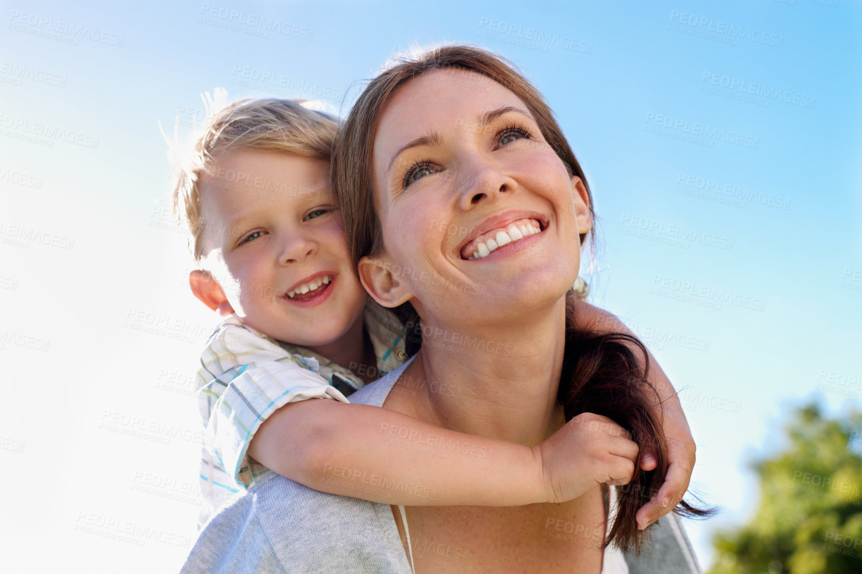 Buy stock photo Piggyback, mother and child in nature for support, trust development and bonding with smile. Low angle, portrait and boy with mom for carry, family security and outdoor for relationship connection