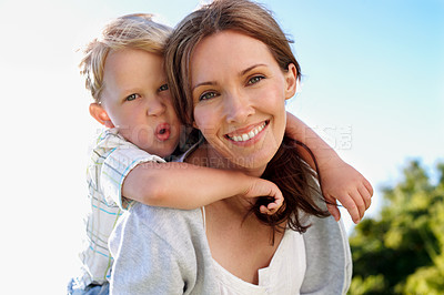 Buy stock photo Portrait, mother and piggyback child in nature for love, parent support and bonding on holiday. Smile, woman or embrace with kid for affection, family connection and playful activity on vacation trip