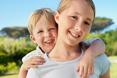 Buy stock photo Siblings, children and piggyback portrait at park for bonding together, relationship and playing. Happy family, sister and carry brother in nature for affection, love connection or support on weekend