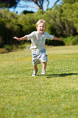 Buy stock photo Happy, child and running in portrait at park for flying game, imaginative play and healthy growth. Cheerful, boy kid and energy on weekend for fun development, fantasy airplane and freedom on grass
