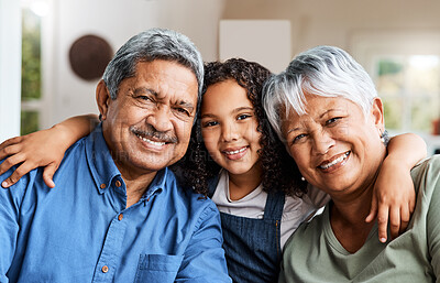 Buy stock photo Portrait, grandparents and hug in home with grandchild, smile and bonding together for weekend visit. Senior people, grandmother and grandfather with girl, embrace and support for family connection.