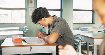 Buy stock photo Student, boy and writing in classroom with assessment, english test or high school education for growth. Teenager, notes or learning in academy with knowledge development, language exam or assignment
