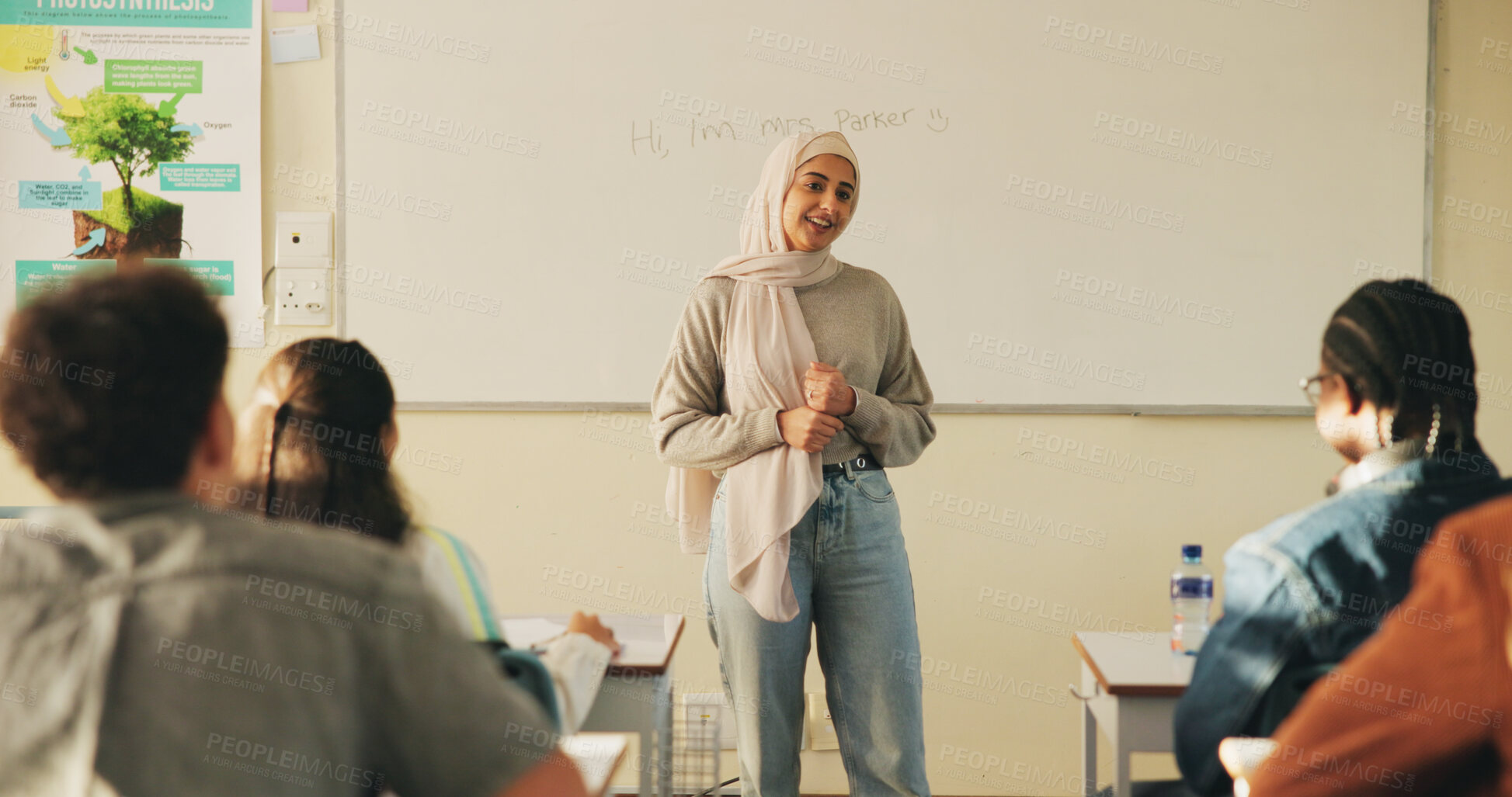 Buy stock photo Teacher, students or woman with hijab in classroom, education or curriculum for knowledge development. Teaching, pupils or Muslim educator with project info for assignment, academic lesson or smile