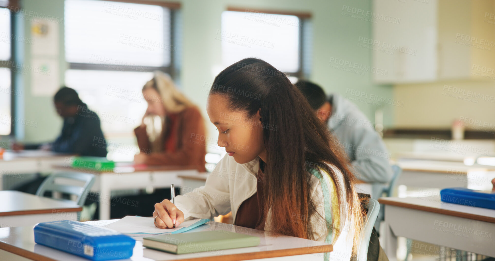 Buy stock photo College, student and writing in classroom with test, assessment and education for knowledge growth. Woman, study and peers in university with academic exam, intelligence and learning development.
