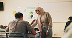 Student, teacher or muslim woman in classroom with advice, education or explain task for biology. Islamic person, educator and talk in high school with teaching, tips or help for life science project