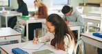College, student and writing in classroom with exam, assessment and education for knowledge growth. Woman, learning and test in university with academic course, intelligence and skill development.