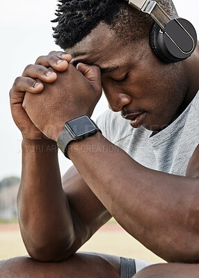 Buy stock photo Headphones, sad or tired man outdoor for fitness with exercise fail, exhausted or listening to audio. Music, black person and athlete on break in nature with stress, fatigue and sports mistake
