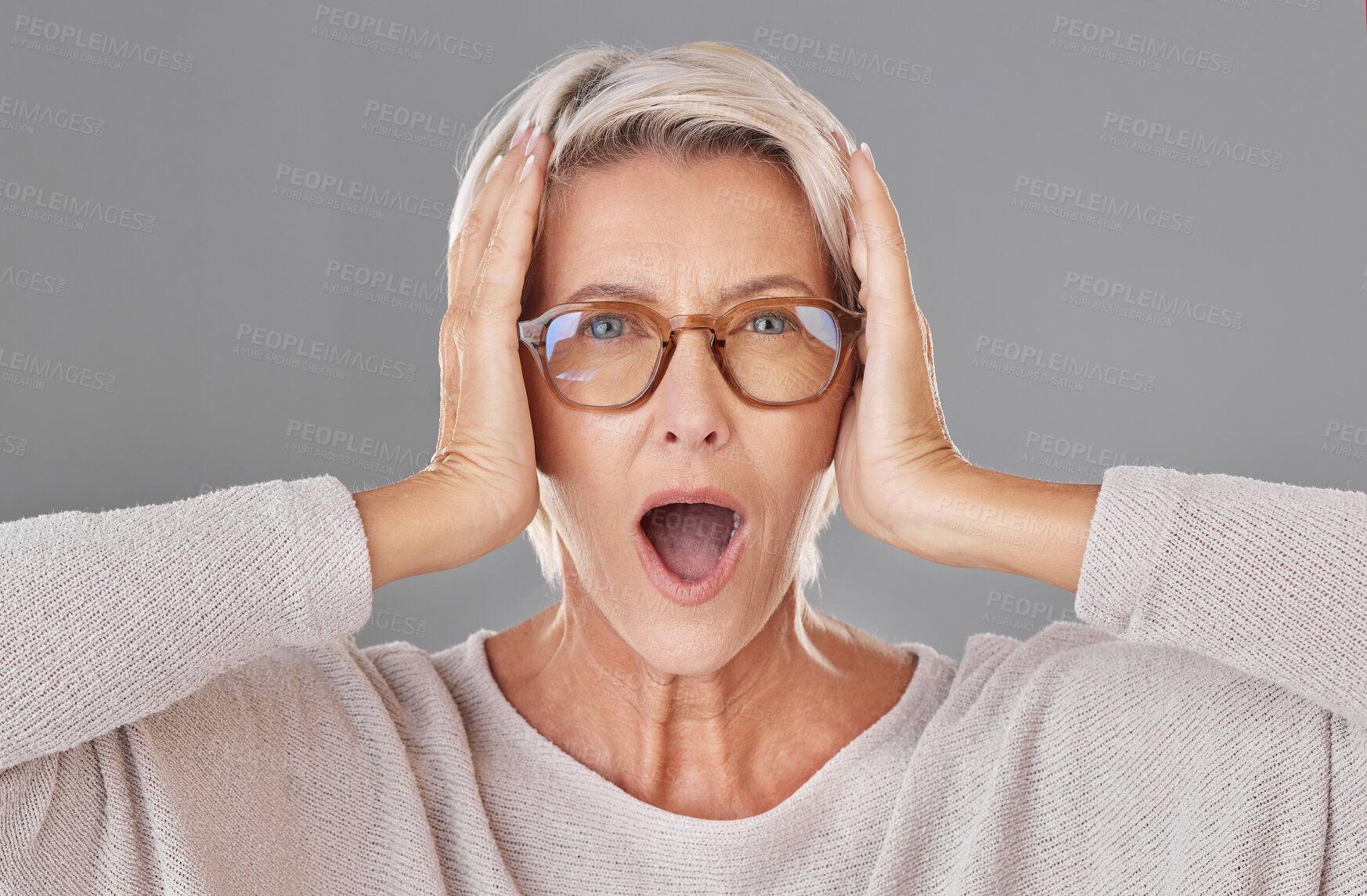 Buy stock photo Portrait, glasses and mature woman in studio with wow for sale, discount or special offer. Surprise, face and person with eye care, optometry or prescription lens promotion on gray background