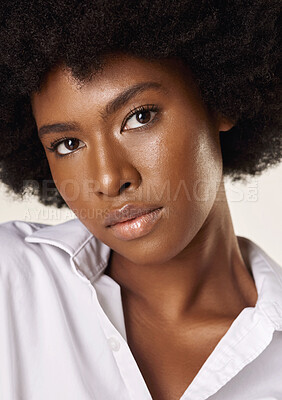 Buy stock photo Serious, skincare and portrait of black woman in studio for self care, glow cosmetics and hydration. Natural, dermatology and person with shine on white background for wellness, cosmetology and afro