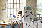 Attractive mixed race girl opening fridge wearing pyjamas